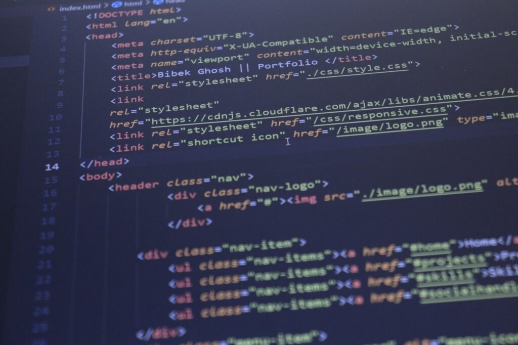 Close-up view of HTML and CSS code displayed on a computer screen, ideal for programming and technology themes.